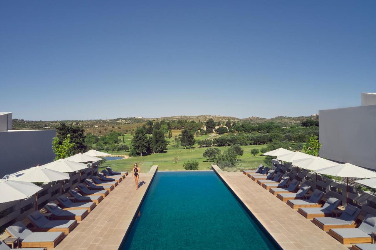 Minthis Resort Tsadha 외부 사진 The pool at the hotel